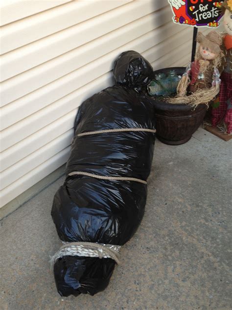 halloween fake body bag|halloween dolls carrying body.